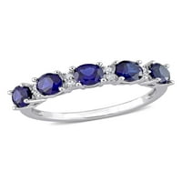 Jubilarni prsten od srebra stvorio je 1 karatni Plavi safir i bijeli Safir.
